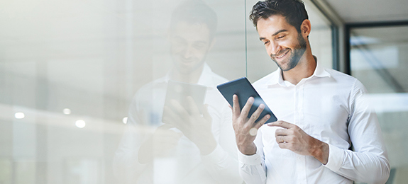  Man looking at a tablet device