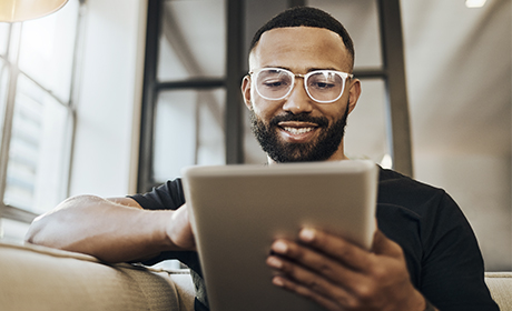 Man browsing a tablet