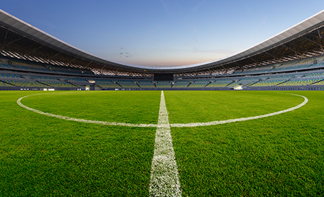 Image of a centre circle in a football stadium