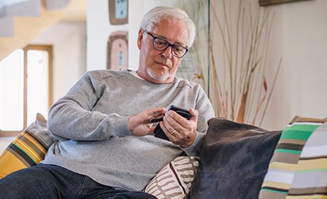 Image of old man sitting on the couch