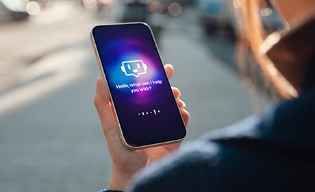 Image of someone using an AI assistant on their phone