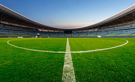 Image of a centre circle in a football stadium