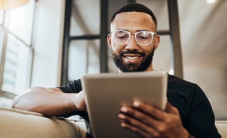 Man browsing a tablet